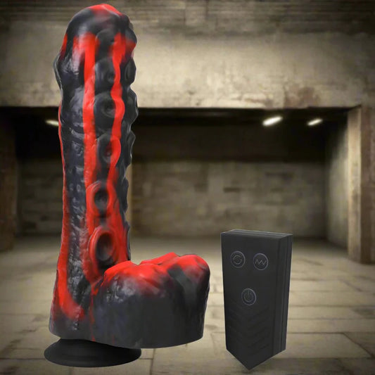 Rechargeable red and black silicone thrusting dildo with remote control in industrial setting.