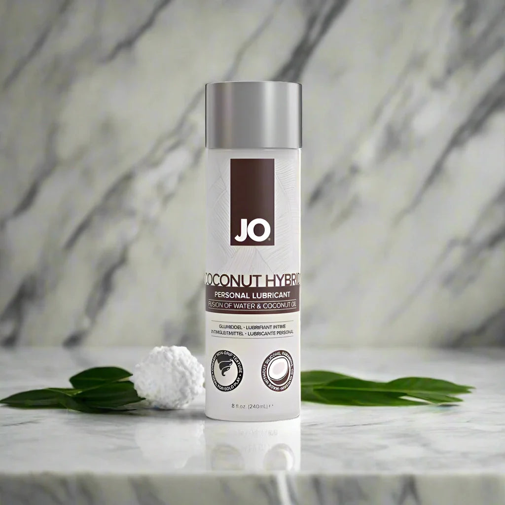 A bottle of JO Coconut Hybrid Original Lubricant with a white label and silver cap, prominently displaying the brand logo 'JO' at the top.